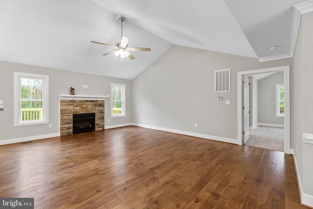 9712 Sutter Rd, Partlow, VA 22534 - unfurnished living room featuring ceiling fan, lofted ceiling, wood finished floors, a stone fireplace, and baseboards