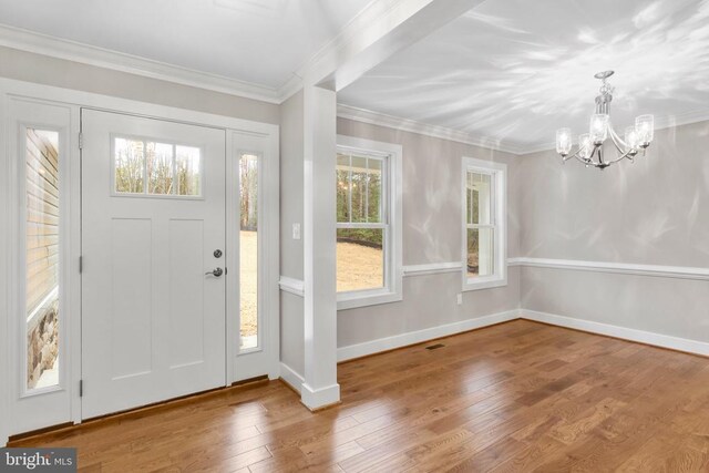9712 Sutter Rd, Partlow, VA 22534 - foyer featuring a chandelier, wood-type flooring, crown molding, and baseboards