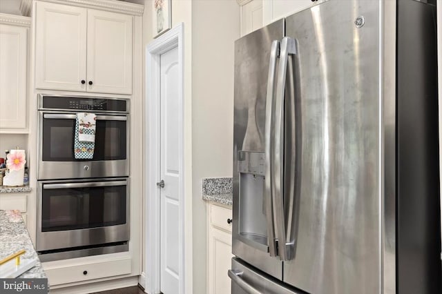 11402 Osprey Trl, Spotsylvania, VA 22551 - kitchen featuring stainless steel appliances, white cabinets, and light stone countertops
