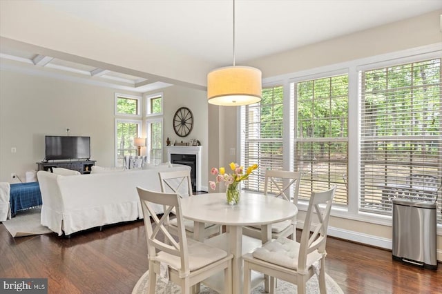 11402 Osprey Trl, Spotsylvania, VA 22551 - dining area with dark wood-style floors, a fireplace, baseboards, beam ceiling, and coffered ceiling