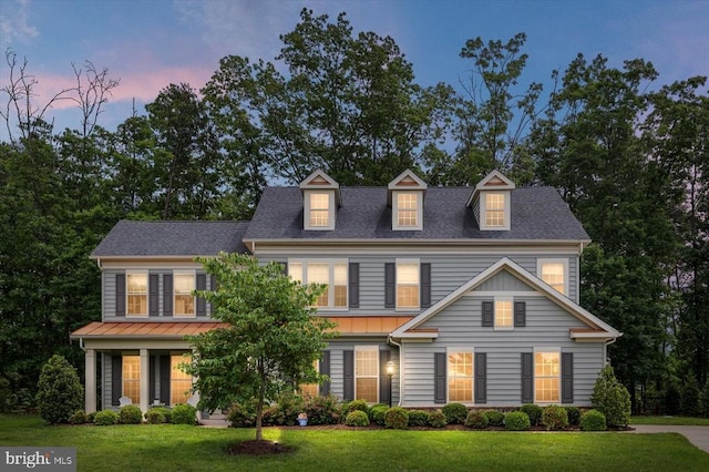 11402 Osprey Trl, Spotsylvania, VA 22551 - view of front of home with a yard, a shingled roof, and a standing seam roof