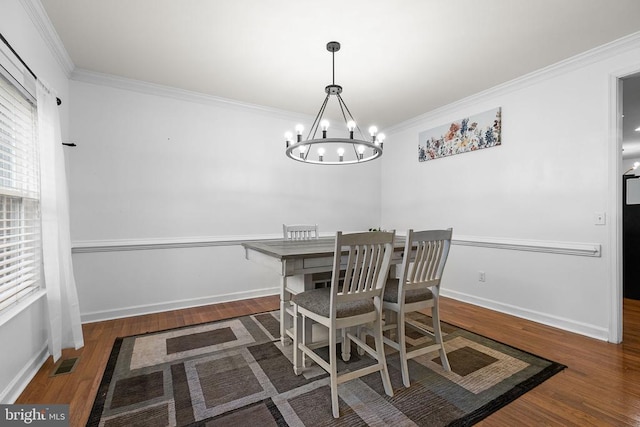 9900 Wellford Ct, Fredericksburg, VA 22407 - dining area featuring a chandelier, ornamental molding, wood finished floors, and baseboards