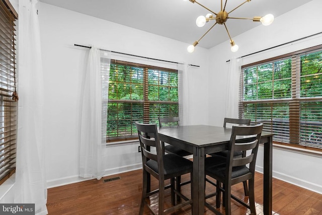 9900 Wellford Ct, Fredericksburg, VA 22407 - dining space with healthy amount of natural light, wood finished floors, and a chandelier