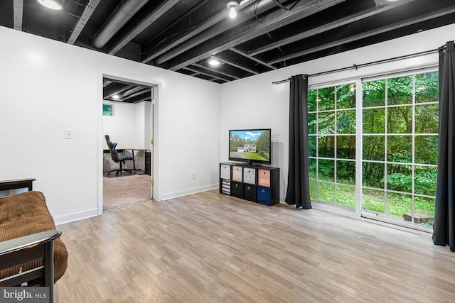 9900 Wellford Ct, Fredericksburg, VA 22407 - living area featuring wood finished floors, plenty of natural light, and baseboards