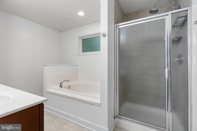 9900 Wellford Ct, Fredericksburg, VA 22407 - full bath featuring a shower stall, a garden tub, vanity, tile patterned floors, and baseboards