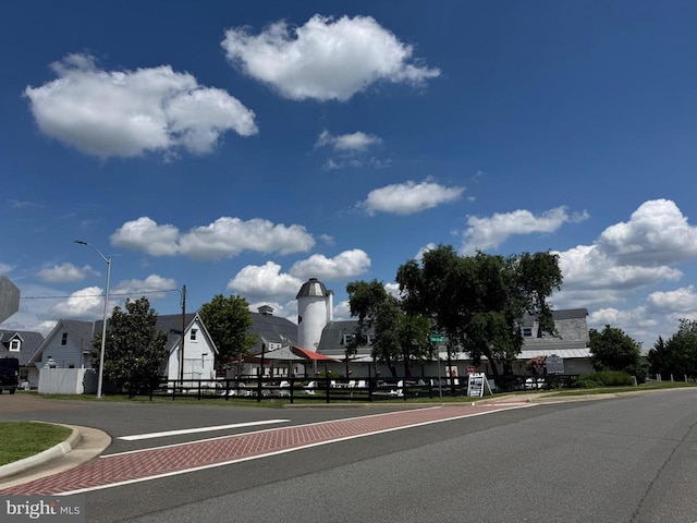  - view of asphalt street with curbs and street lighting