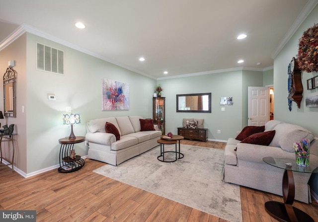  - living area with wood finished floors, recessed lighting, baseboards, and crown molding