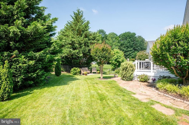  - view of yard featuring a wooden deck