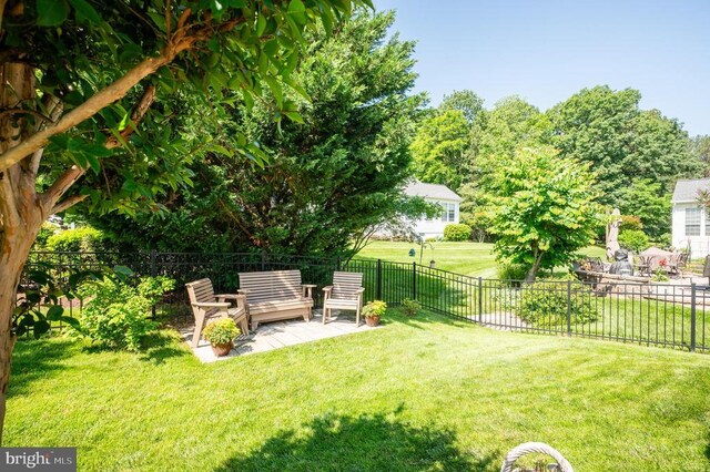  - view of yard with an outdoor living space and a patio