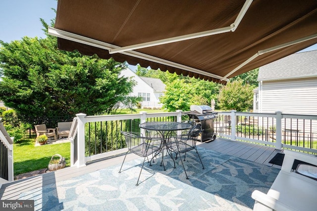  - view of patio / terrace featuring outdoor dining area, a deck, and grilling area