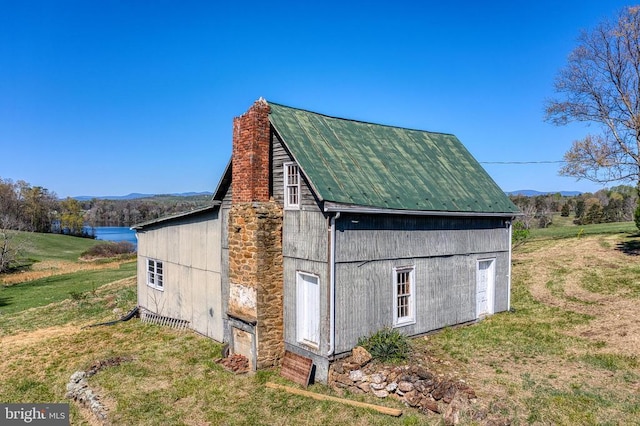 view of outbuilding with a mountain view