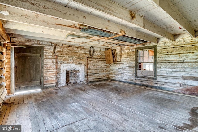 unfurnished living room with hardwood / wood-style flooring and a fireplace