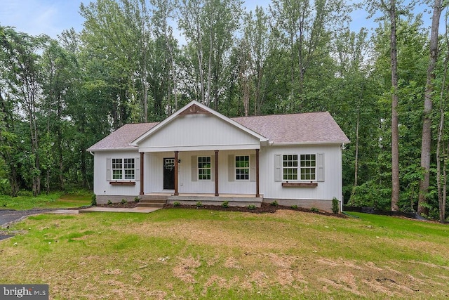 13191 Scotts Ml, Culpeper, VA 22701 - view of front facade featuring covered porch, a front yard, and a shingled roof