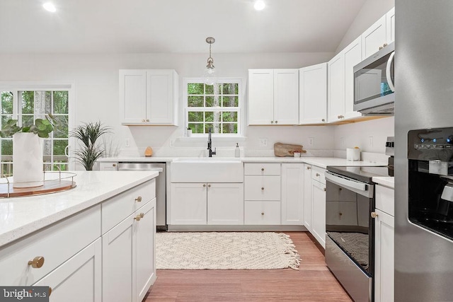 13191 Scotts Ml, Culpeper, VA 22701 - kitchen featuring appliances with stainless steel finishes, a sink, plenty of natural light, white cabinetry, and vaulted ceiling