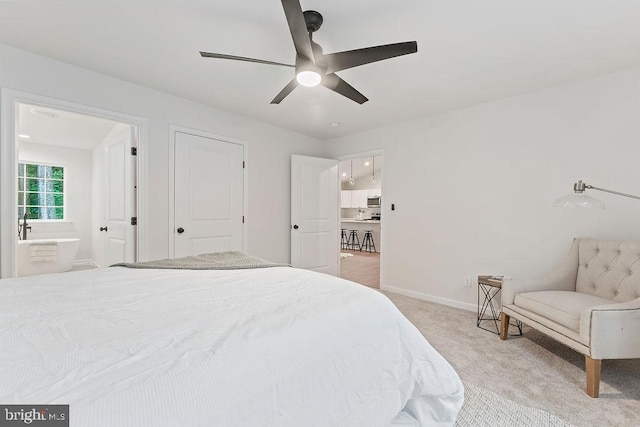 13191 Scotts Ml, Culpeper, VA 22701 - bedroom with light carpet, baseboards, ensuite bath, and a ceiling fan