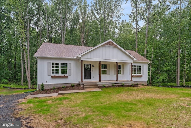 13191 Scotts Ml, Culpeper, VA 22701 - modern farmhouse style home featuring covered porch, a front lawn, and roof with shingles