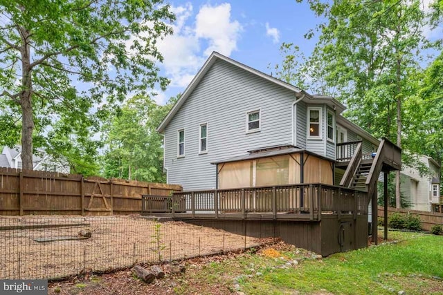 10603 Eden Brook Dr, Spotsylvania, VA 22553 - rear view of house featuring a wooden deck, a fenced backyard, and stairs
