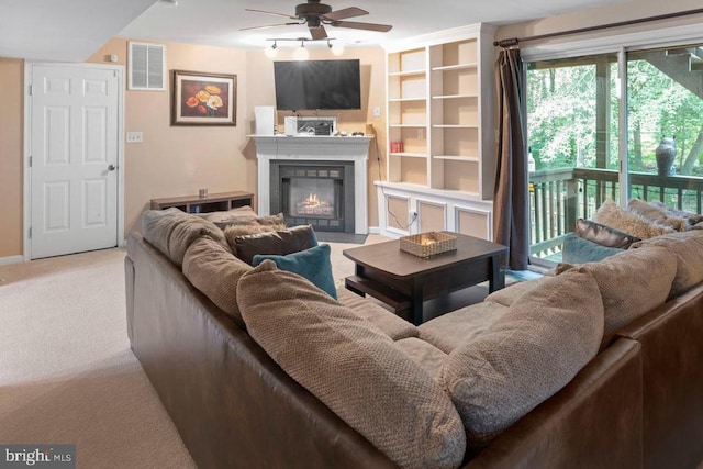 10603 Eden Brook Dr, Spotsylvania, VA 22553 - living room with a ceiling fan, carpet flooring, and a glass covered fireplace