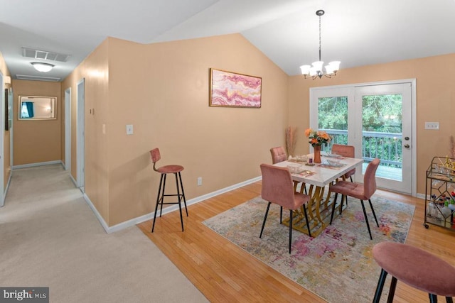 10603 Eden Brook Dr, Spotsylvania, VA 22553 - dining room featuring baseboards, a chandelier, light wood-type flooring, and lofted ceiling
