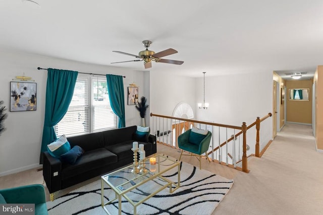 10603 Eden Brook Dr, Spotsylvania, VA 22553 - carpeted living room with baseboards, a ceiling fan, and a chandelier
