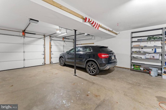 10603 Eden Brook Dr, Spotsylvania, VA 22553 - garage featuring a garage door opener