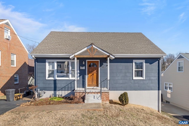 bungalow featuring a shingled roof