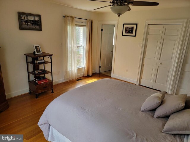  - bedroom featuring wood finished floors and ceiling fan
