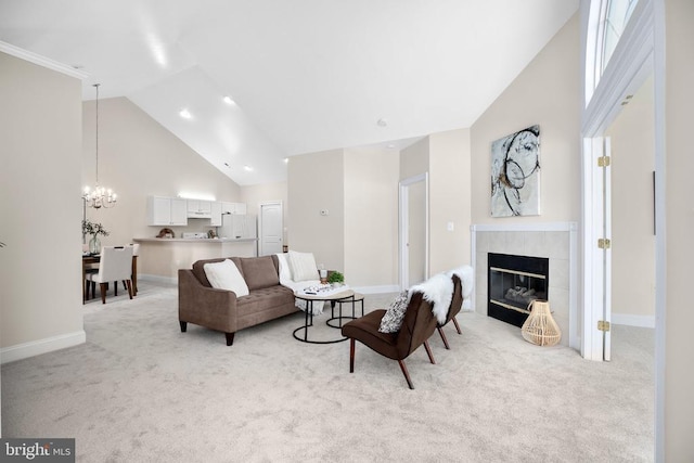 6231 Autumn Leaf Dr, Fredericksburg, VA 22407 - living area with high vaulted ceiling, light carpet, a fireplace, a chandelier, and baseboards