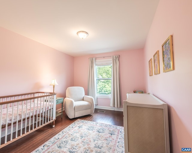 142 Junction Ln, Charlottesville, VA 22902 - bedroom with wood-type flooring and a nursery area