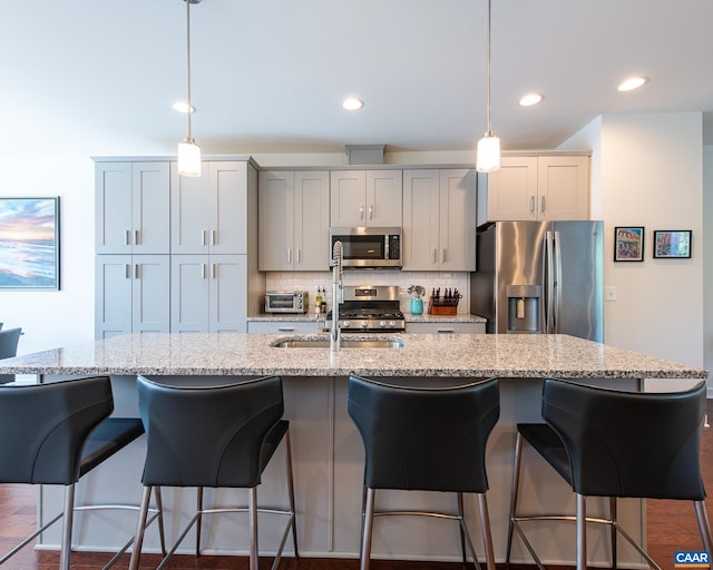 142 Junction Ln, Charlottesville, VA 22902 - kitchen featuring appliances with stainless steel finishes, a kitchen island with sink, tasteful backsplash, pendant lighting, and recessed lighting