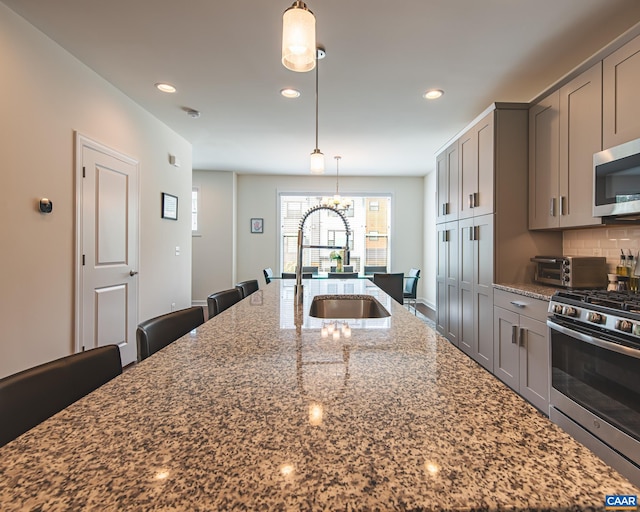 142 Junction Ln, Charlottesville, VA 22902 - kitchen with appliances with stainless steel finishes, gray cabinetry, dark stone countertops, a large island, and recessed lighting