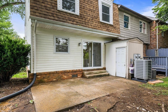 1114 Mountain View Dr, Harrisonburg, VA 22801 - rear view of property featuring entry steps, a shed, a patio, and a shingled roof
