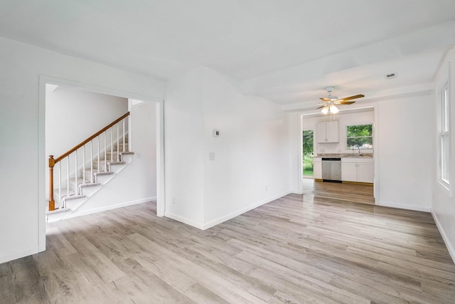 1114 Mountain View Dr, Harrisonburg, VA 22801 - unfurnished living room featuring stairway, light wood-style floors, and ceiling fan