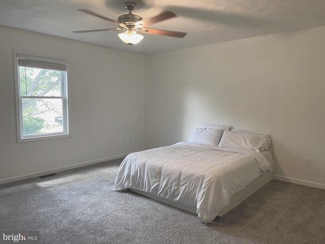  - bedroom with carpet, a textured ceiling, and ceiling fan