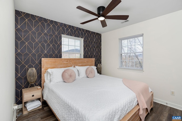 57 Pounding Branch Rd, Afton, VA 22920 - bedroom with wallpapered walls, visible vents, dark wood-style flooring, baseboards, and an accent wall