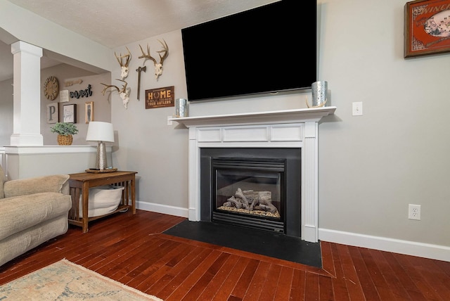 118 Wexford St, Staunton, VA 24401 - living area with ornate columns, wood-type flooring, and a fireplace with flush hearth