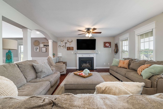 118 Wexford St, Staunton, VA 24401 - living room featuring decorative columns, a ceiling fan, wood finished floors, and a fireplace with flush hearth