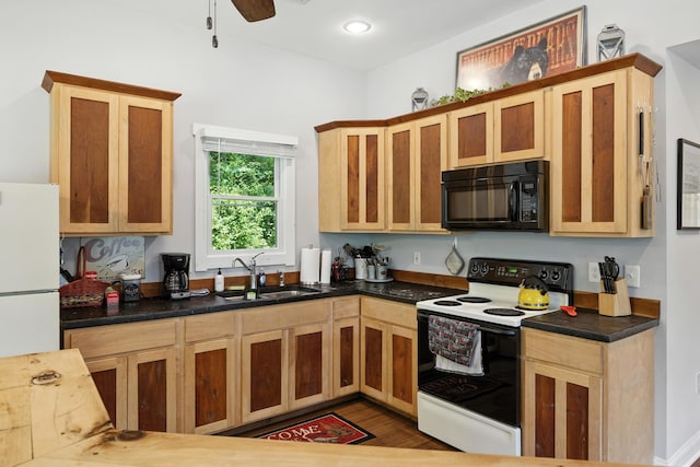 123 Fishermans Ln, Luray, VA 22835 - kitchen featuring white appliances, wood finished floors, dark countertops, and ceiling fan