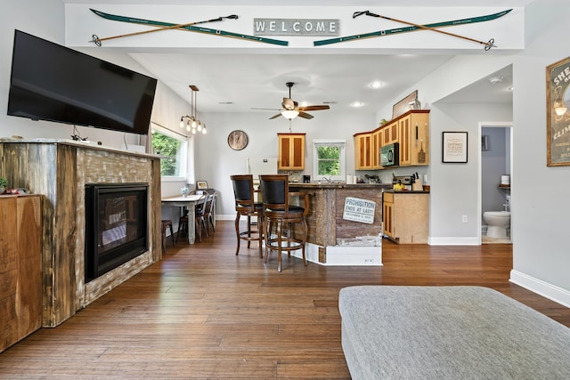 123 Fishermans Ln, Luray, VA 22835 - kitchen with black microwave, a tiled fireplace, dark countertops, healthy amount of natural light, and recessed lighting