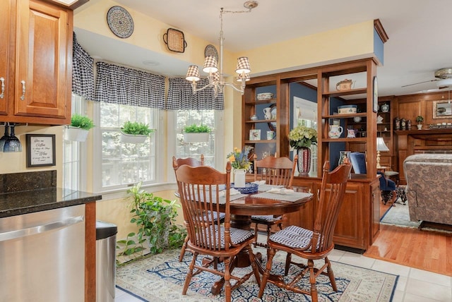 225 Divot Dr, Harrisonburg, VA 22802 - dining area with light tile patterned flooring and a chandelier
