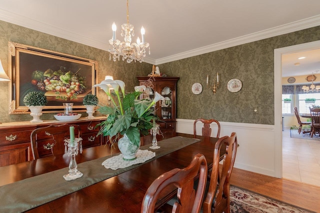 225 Divot Dr, Harrisonburg, VA 22802 - dining space featuring a chandelier, wainscoting, wood finished floors, crown molding, and wallpapered walls