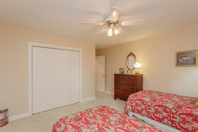 225 Divot Dr, Harrisonburg, VA 22802 - bedroom with light carpet, a closet, a ceiling fan, and baseboards