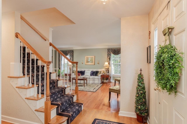 225 Divot Dr, Harrisonburg, VA 22802 - entrance foyer with light wood-type flooring, stairway, baseboards, and ornamental molding