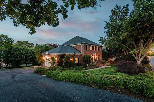 225 Divot Dr, Harrisonburg, VA 22802 - view of front of house featuring driveway, a garage, and brick siding