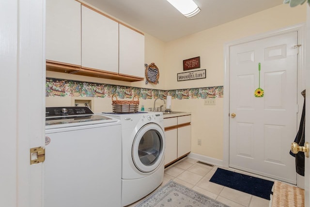 225 Divot Dr, Harrisonburg, VA 22802 - laundry area featuring cabinet space, washing machine and dryer, and light tile patterned flooring