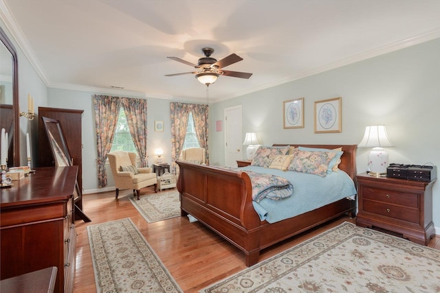 225 Divot Dr, Harrisonburg, VA 22802 - bedroom with light wood finished floors, crown molding, baseboards, and ceiling fan