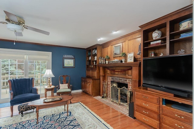 225 Divot Dr, Harrisonburg, VA 22802 - living room with a fireplace, ceiling fan, light wood-type flooring, baseboards, and ornamental molding