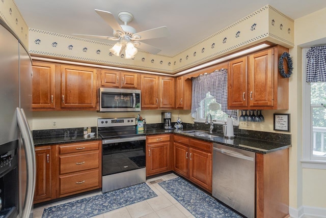 225 Divot Dr, Harrisonburg, VA 22802 - kitchen with stainless steel appliances, a sink, ceiling fan, and brown cabinets