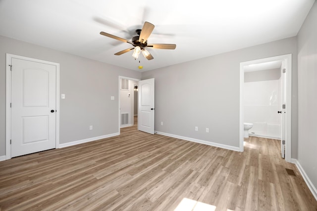 TBD Senedo Rd, Mount Jackson, VA 22842 - unfurnished bedroom featuring light wood-style floors, connected bathroom, and a ceiling fan