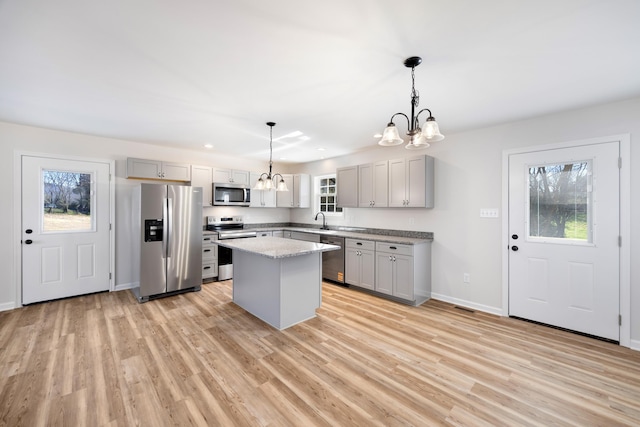 TBD Senedo Rd, Mount Jackson, VA 22842 - kitchen featuring appliances with stainless steel finishes, a chandelier, gray cabinetry, and light wood finished floors
